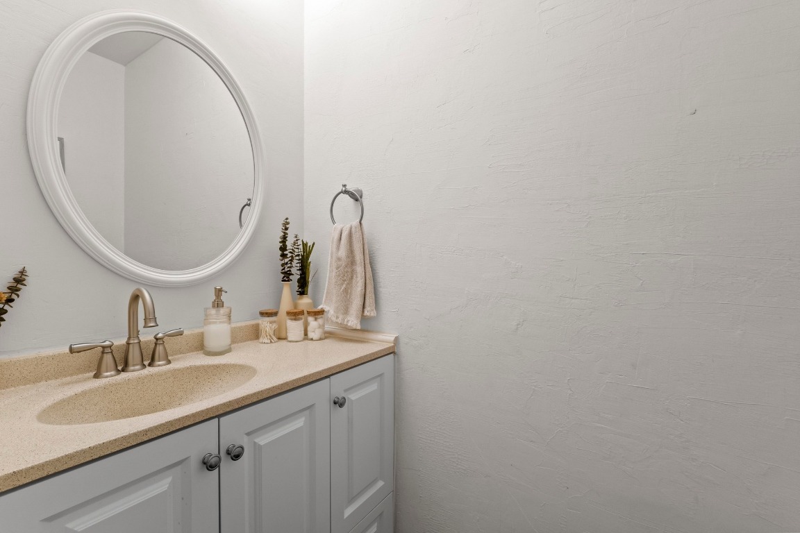 3801 Menchaca Road, Unit 5 Austin, TX 78704 - Photo 26 of 40 a bathroom with a sink and a mirror