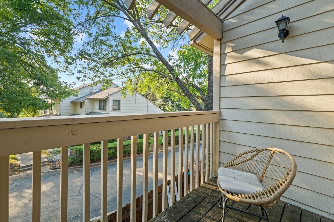 3801 Menchaca Road, Unit 5 Austin, TX 78704 - Photo 29 of 40 a view of a chair in wooden deck