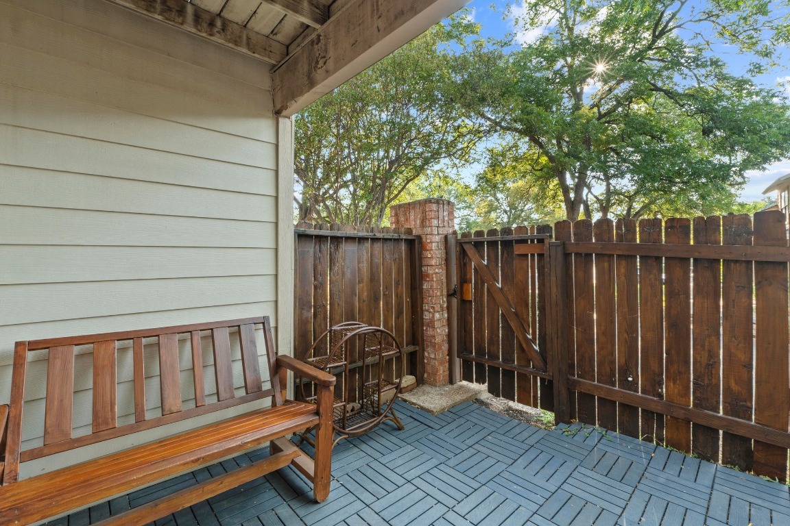 3801 Menchaca Road, Unit 5 Austin, TX 78704 - Photo 30 of 40 a view of backyard with wooden fence and trees