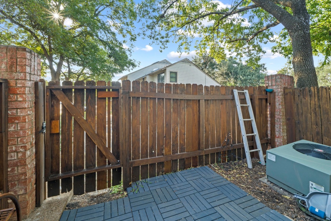 3801 Menchaca Road, Unit 5 Austin, TX 78704 - Photo 31 of 40 a view of a house with wooden fence