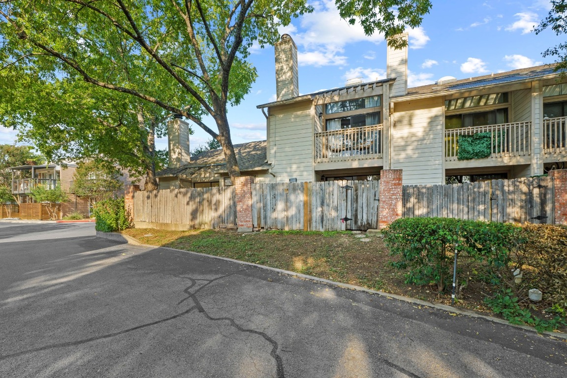 3801 Menchaca Road, Unit 5 Austin, TX 78704 - Photo 33 of 40 a front view of a house with a yard and garage