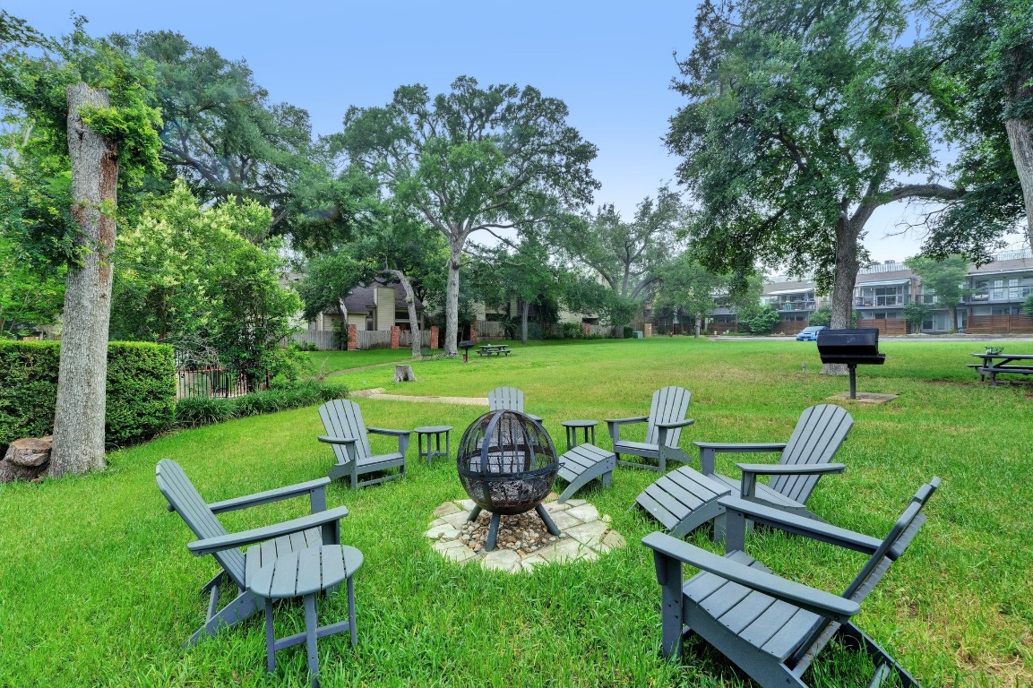 3801 Menchaca Road, Unit 5 Austin, TX 78704 - Photo 35 of 40 a view of a table and chairs in the garden