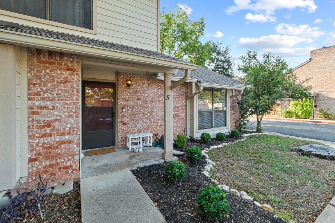 3801 Menchaca Road, Unit 5 Austin, TX 78704 - Photo 4 of 40 a front view of a house with garden