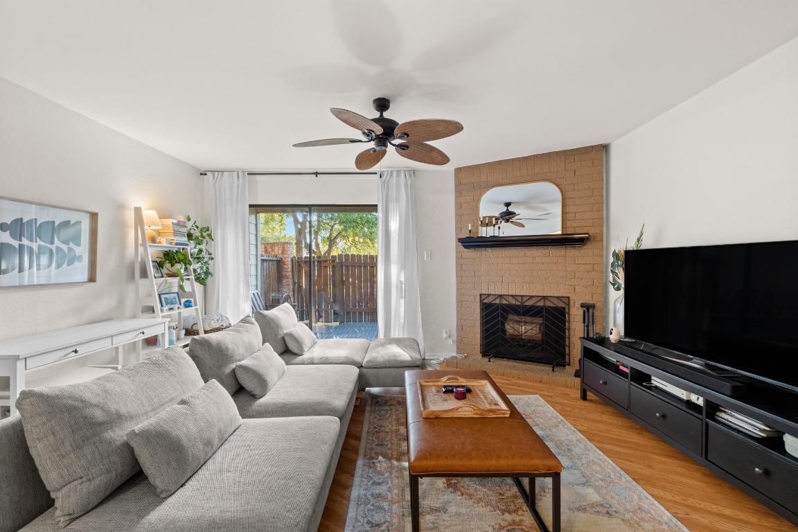 3801 Menchaca Road, Unit 5 Austin, TX 78704 - Photo 8 of 40 a living room with furniture a flat screen tv and a fireplace