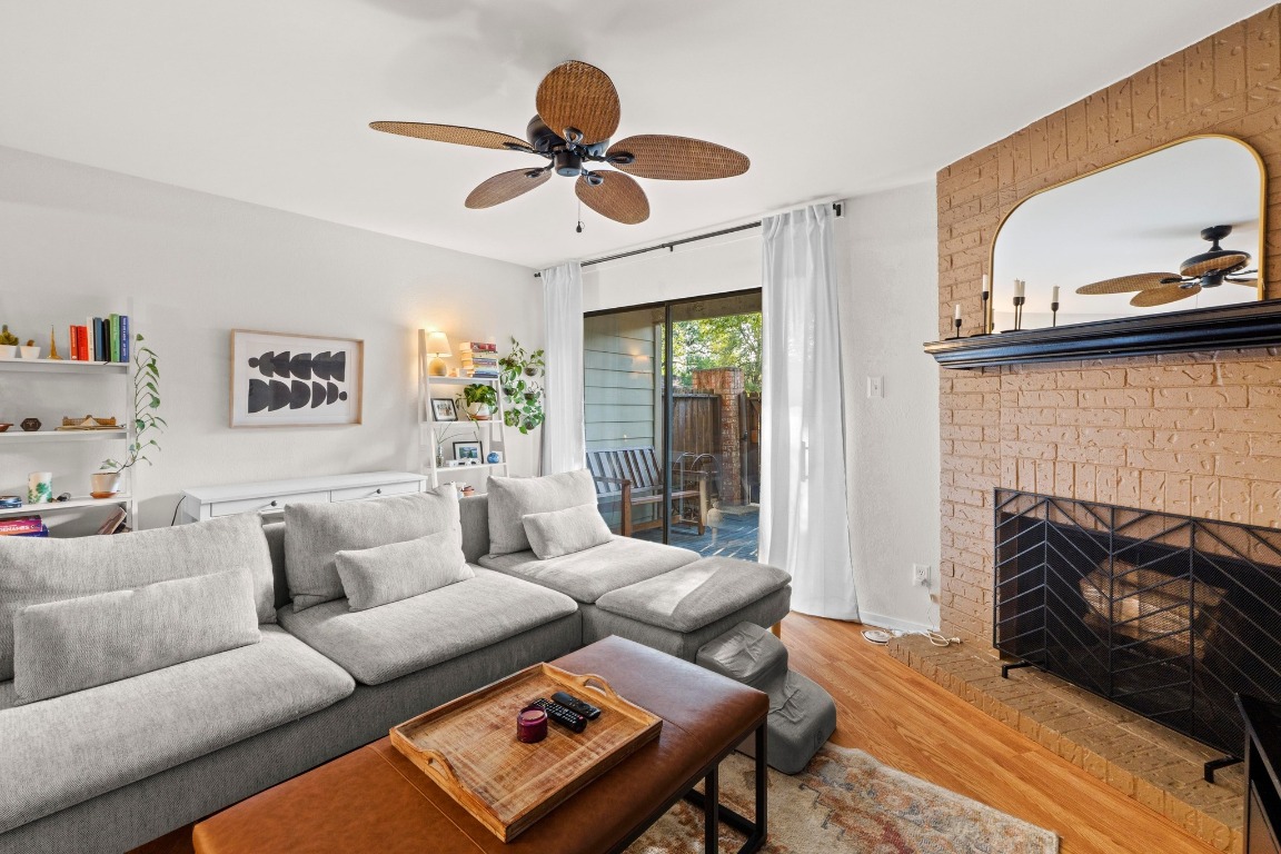 3801 Menchaca Road, Unit 5 Austin, TX 78704 - Photo 9 of 40 a living room with furniture and a fireplace