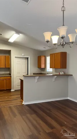 a view of a kitchen with a sink and a stove