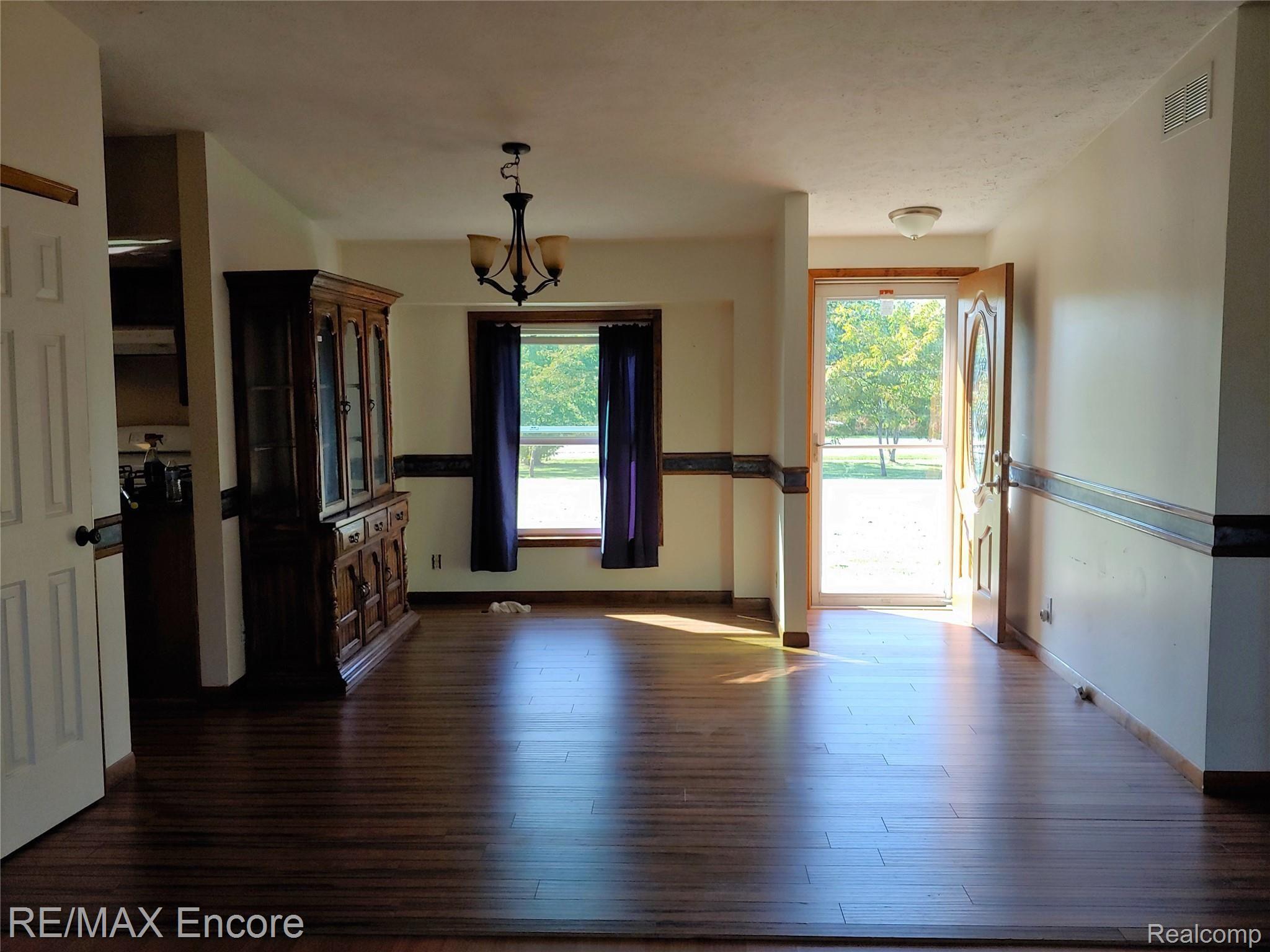 7185 Fostoria Road Mayville, MI 48744 - Photo 8 of 33 DINING ROOM AND FRONT ENTRY