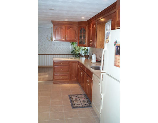 4 Judith Road Chelmsford, MA 01824 - Photo 5 of 6 a kitchen with a sink and cabinets