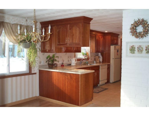 4 Judith Road Chelmsford, MA 01824 - Photo 6 of 6 a kitchen with a sink cabinets and a window