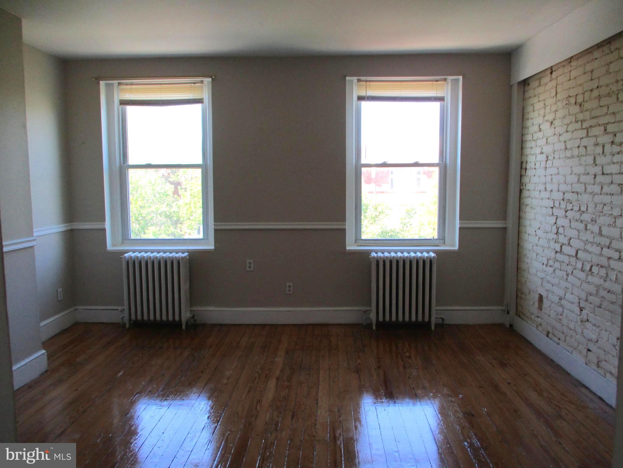 2615 North Calvert Street, Unit 3 Baltimore, MD 21218 - Photo 4 of 15 Living /Dining Area Picture 1