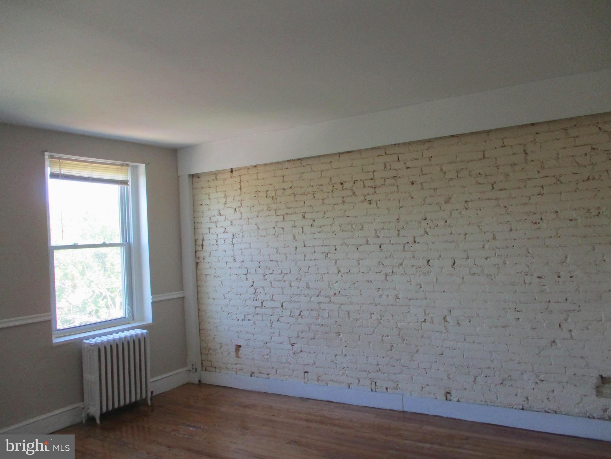 2615 North Calvert Street, Unit 3 Baltimore, MD 21218 - Photo 5 of 15 Living /Dining Area Picture 2
