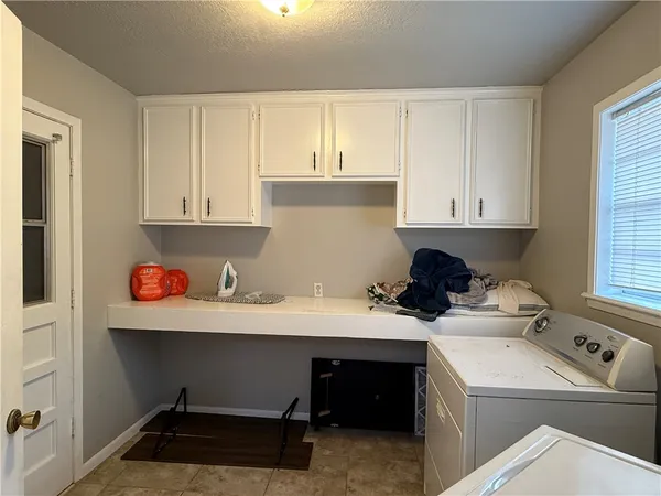 a room with a cabinets and window