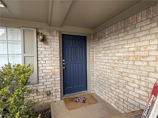 a bathroom with a shower and a sink