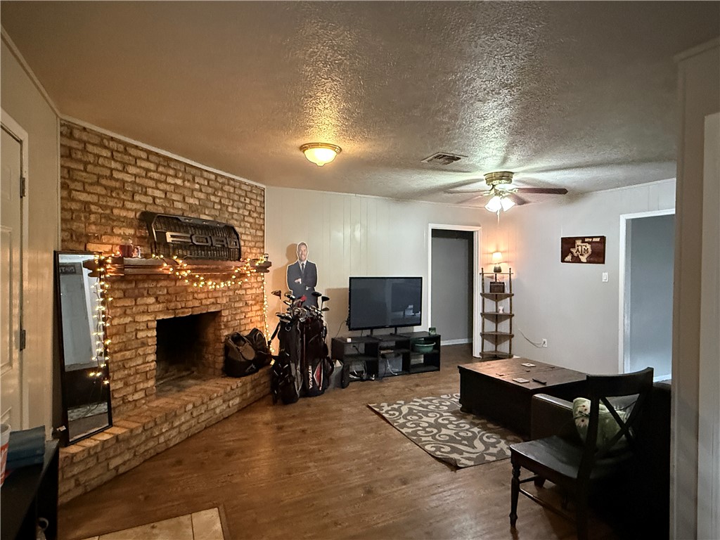 1213 Ridgefield Circle South College Station, TX 77840 - Photo 7 of 25 a living room with furniture and a fireplace