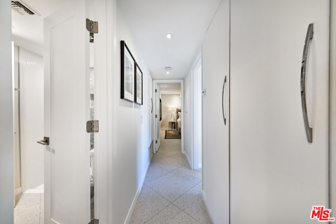 1855 E. Ramon Road, Unit 19 Palm Springs, CA 92264 - Photo 22 of 42 a view of a hallway with closet and wooden floor