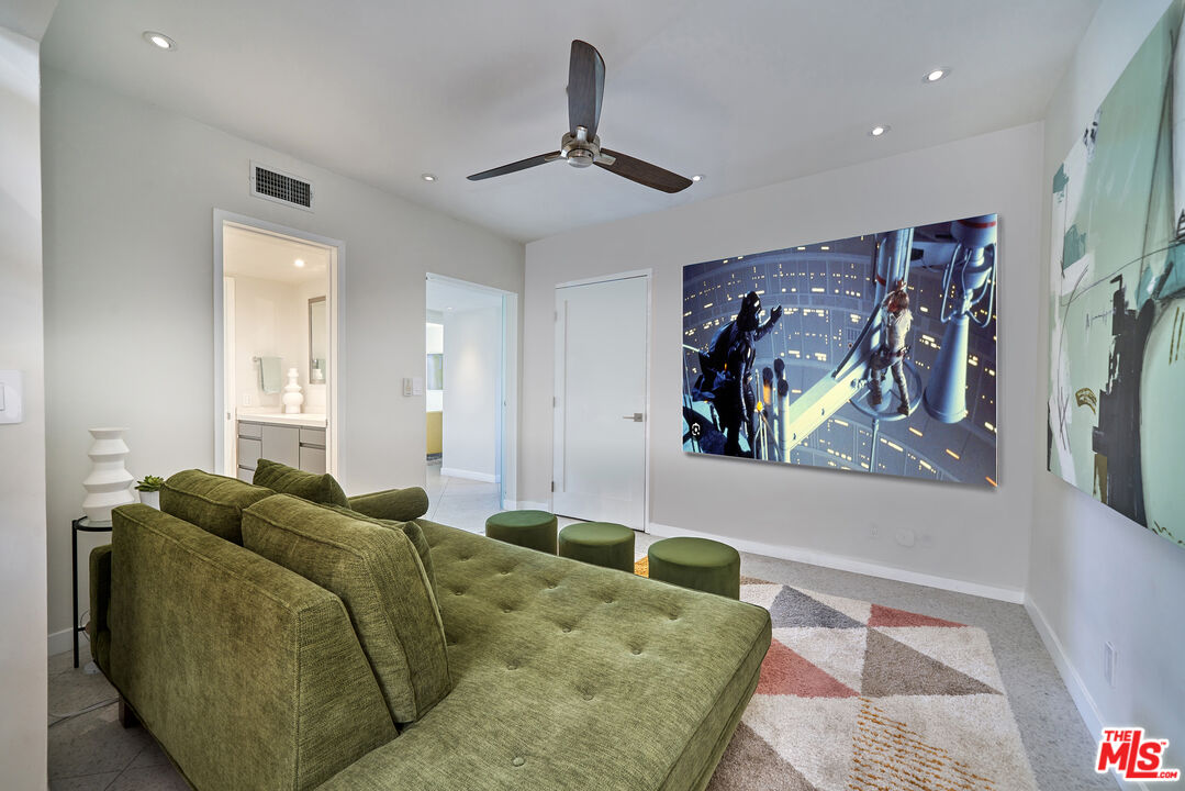 1855 E. Ramon Road, Unit 19 Palm Springs, CA 92264 - Photo 35 of 42 a living room with furniture and ceiling fan