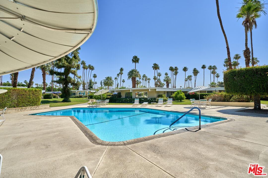 1855 E. Ramon Road, Unit 19 Palm Springs, CA 92264 - Photo 42 of 42 an outdoor space with swimming pool and furniture