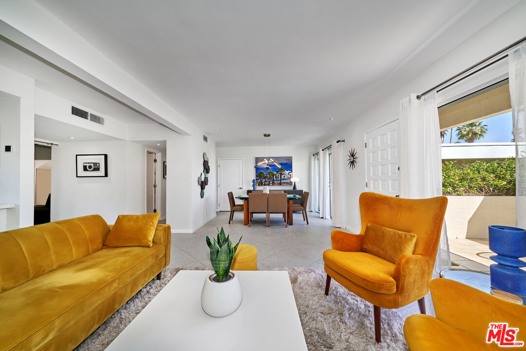 1855 E. Ramon Road, Unit 19 Palm Springs, CA 92264 - Photo 5 of 42 a living room with furniture and a couch