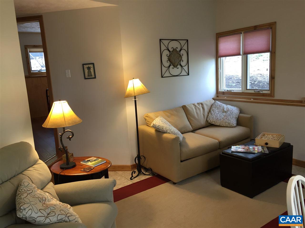 452 Three Ridges, Unit 452 Roseland, VA 22967 - Photo 12 of 28 a living room with furniture a window and a lamp