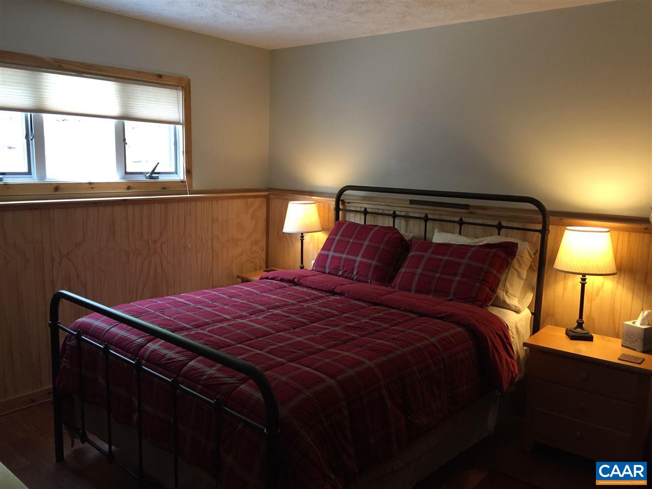 452 Three Ridges, Unit 452 Roseland, VA 22967 - Photo 16 of 28 a bedroom with a bed and a window