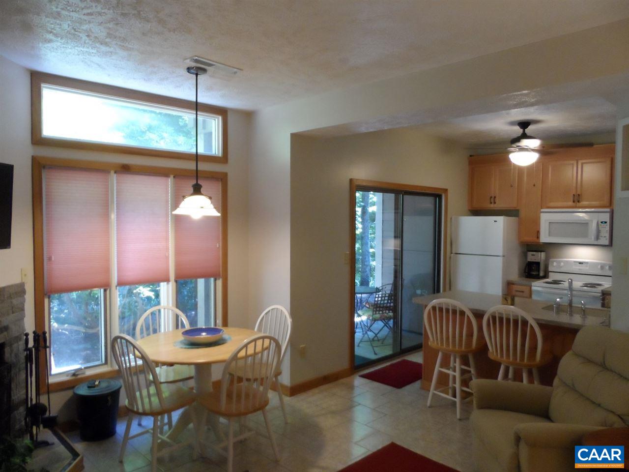 452 Three Ridges, Unit 452 Roseland, VA 22967 - Photo 10 of 28 a dining room with furniture and wooden floor