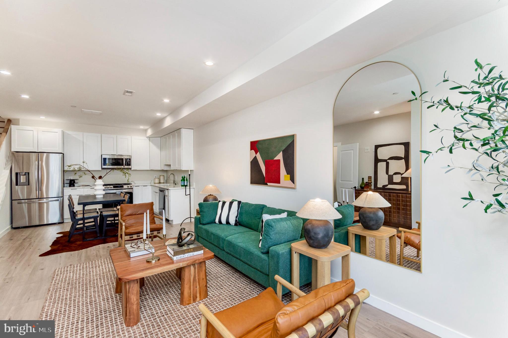 2116 4th Street Northeast, Unit B Washington, DC 20002 - Photo 26 of 28 a living room with furniture kitchen view and a refrigerator