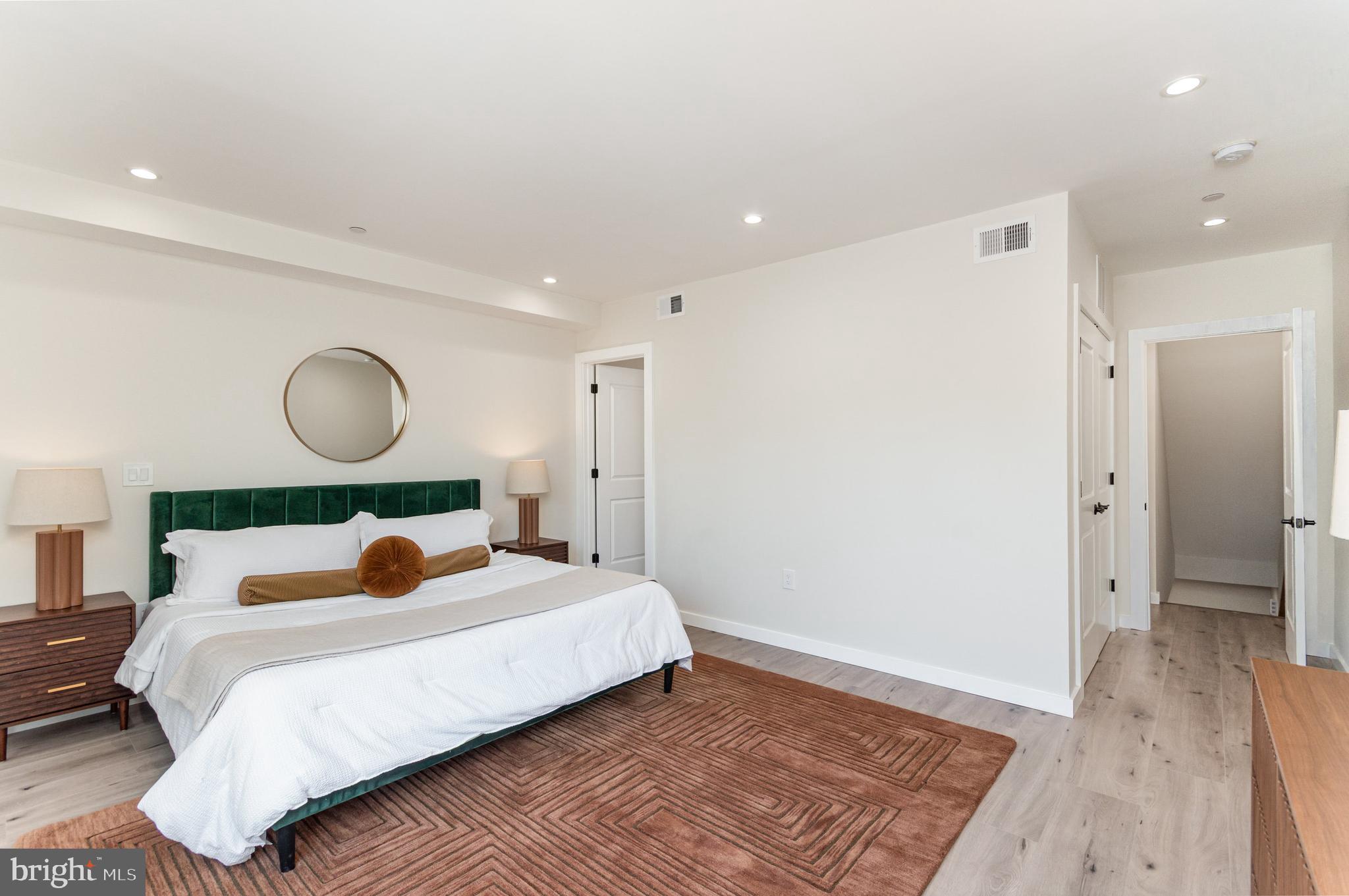 2116 4th Street Northeast, Unit B Washington, DC 20002 - Photo 12 of 28 a bedroom with a bed and a lamp