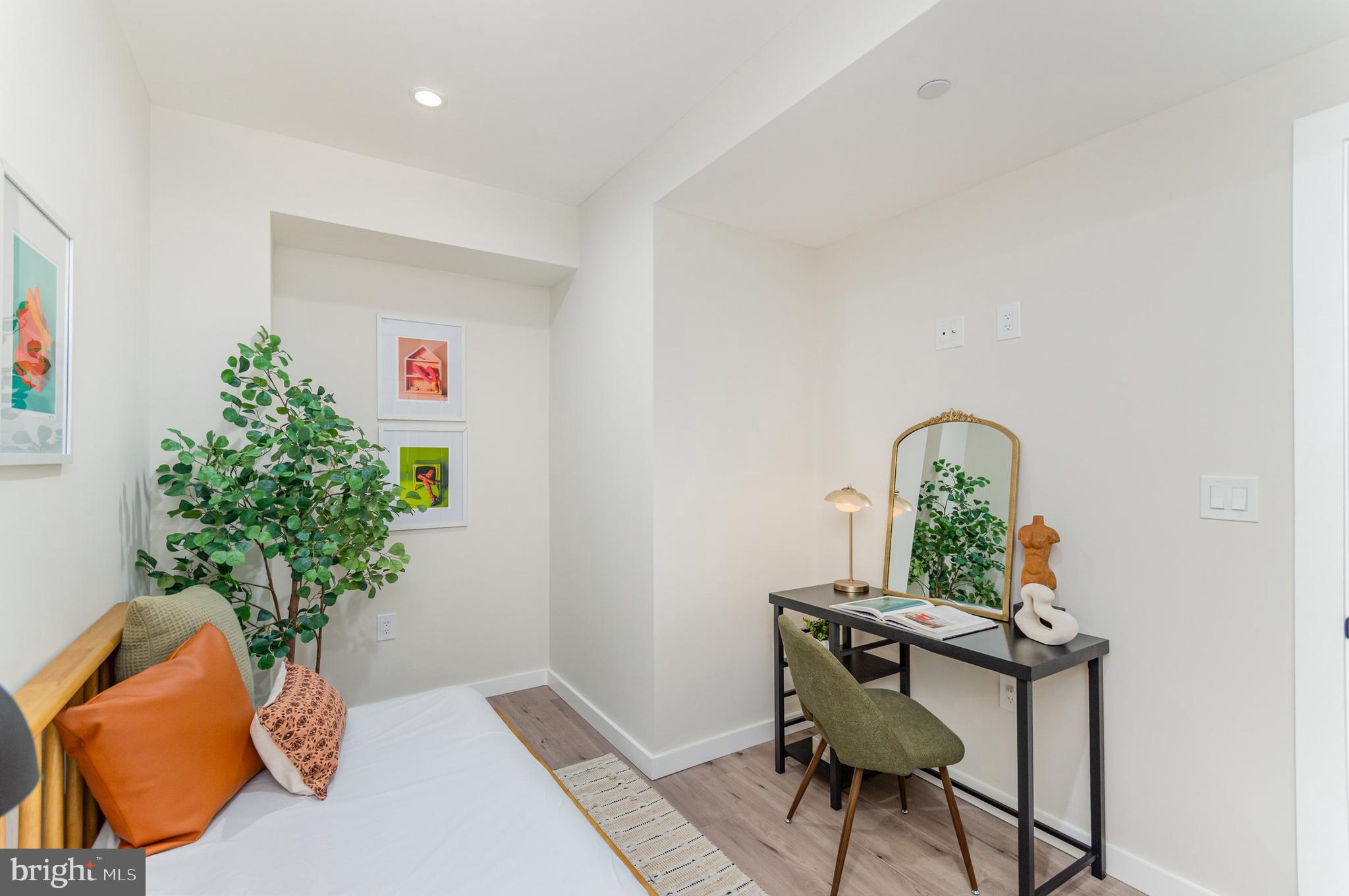 2116 4th Street Northeast, Unit B Washington, DC 20002 - Photo 22 of 28 a workspace with furniture and potted plant