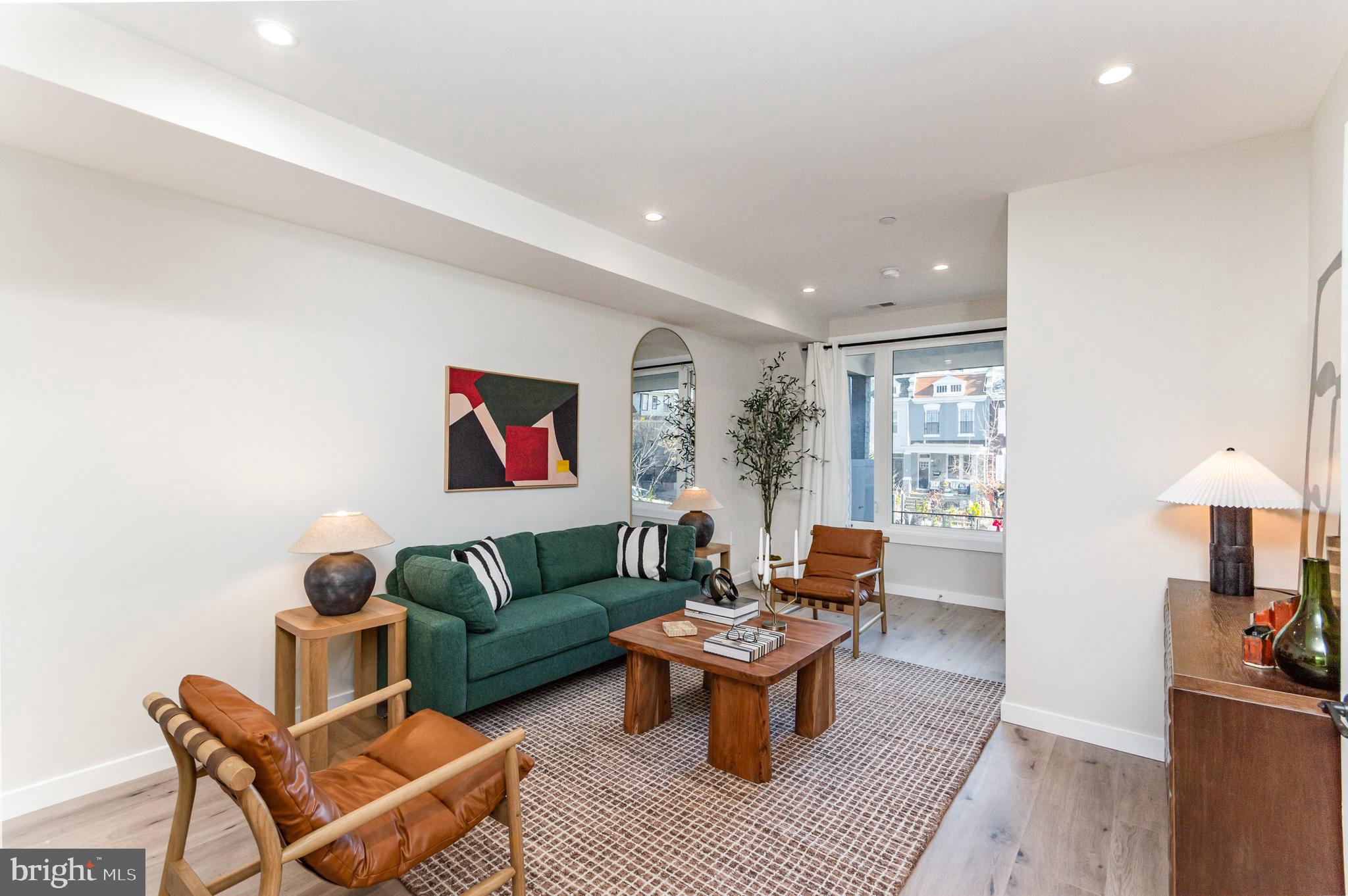 2116 4th Street Northeast, Unit B Washington, DC 20002 - Photo 3 of 28 a living room with furniture a rug and a lamp