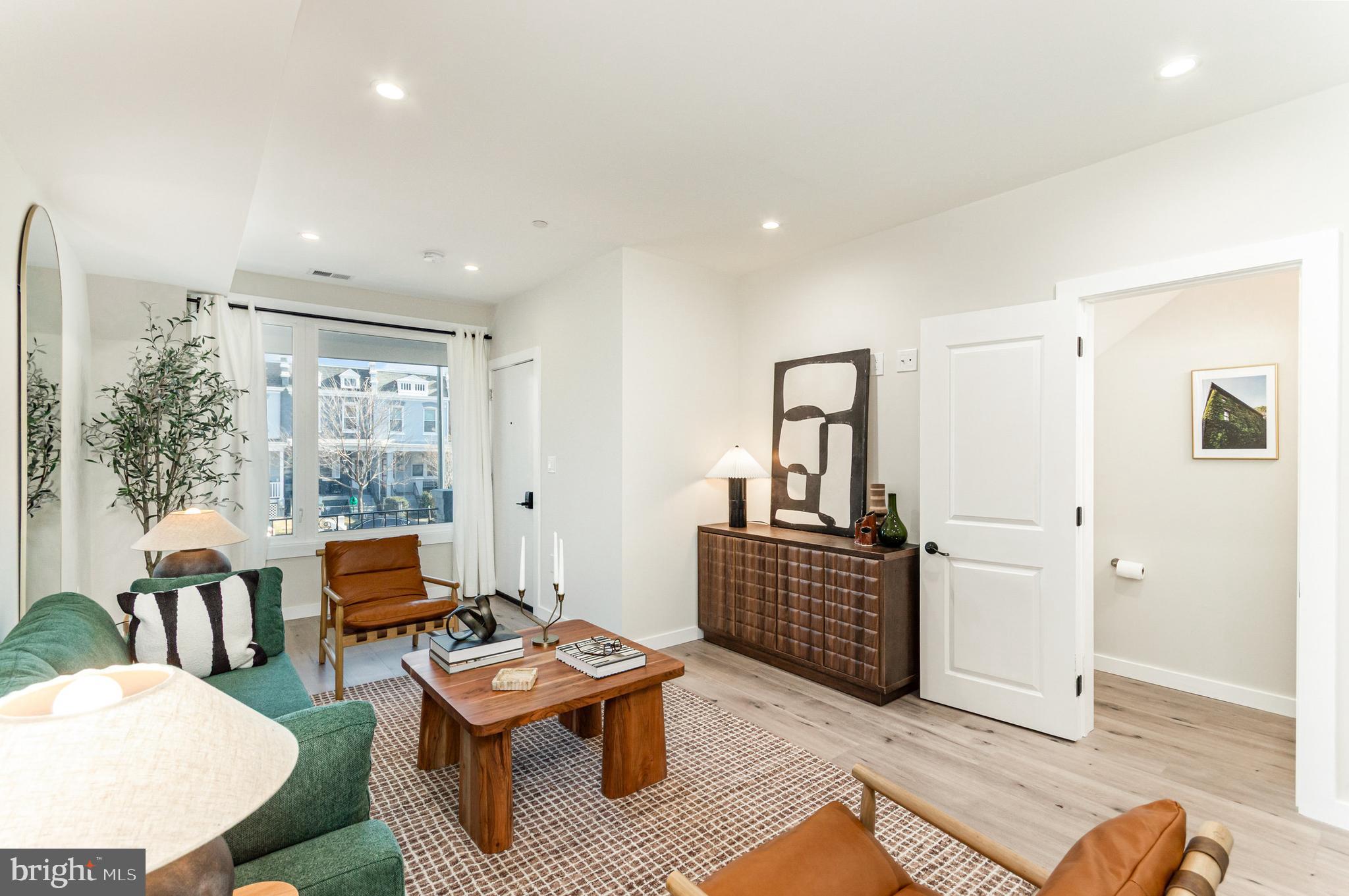 2116 4th Street Northeast, Unit B Washington, DC 20002 - Photo 4 of 28 a living room with furniture and wooden floor