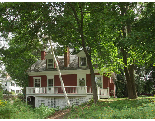 8 Sandy Pond Road Lincoln, MA 01773 - Photo 2 of 3 front view of a house with a yard