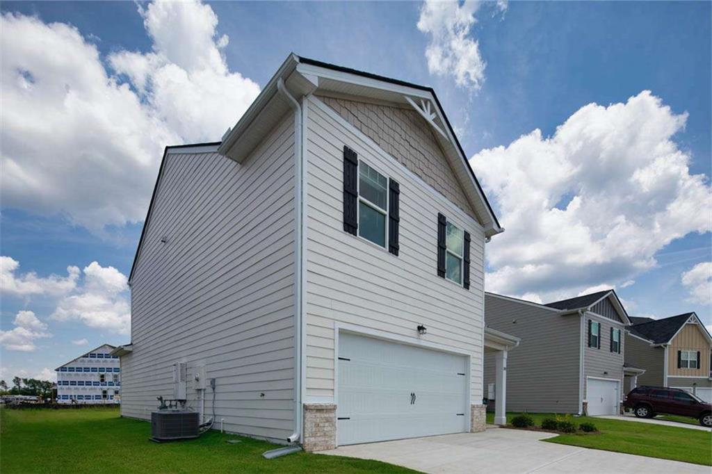 197 Lauritsen Way Newnan, GA 30265 - Photo 1 of 33 a front view of a house with a garden