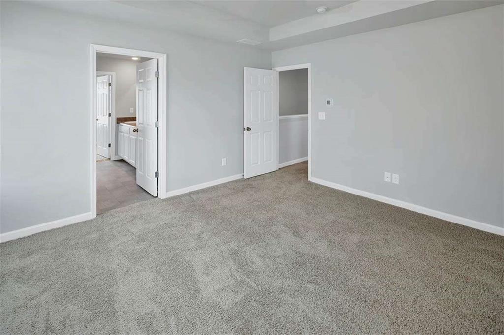 197 Lauritsen Way Newnan, GA 30265 - Photo 14 of 33 a view of an empty room and closet area