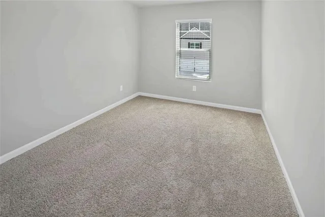 a view of an empty room and closet area
