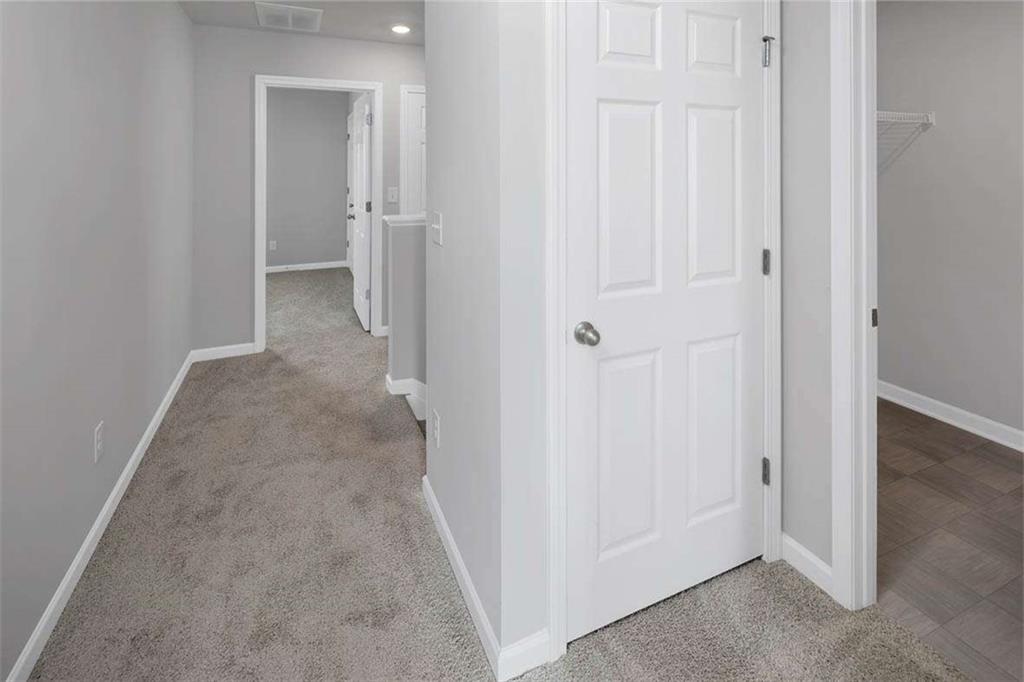 197 Lauritsen Way Newnan, GA 30265 - Photo 29 of 33 an empty room with a hallway