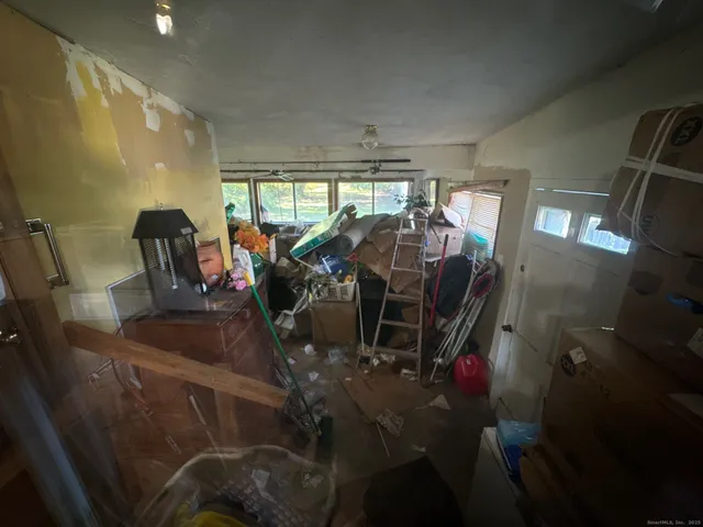 a view of a room with wooden floor