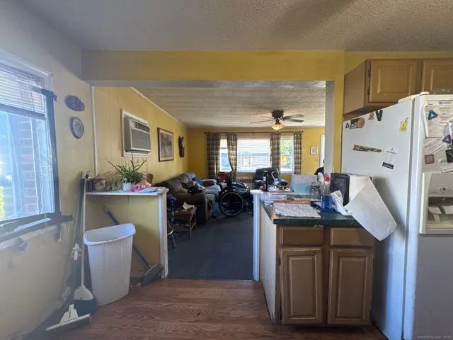 a view of living room and kitchen with furniture