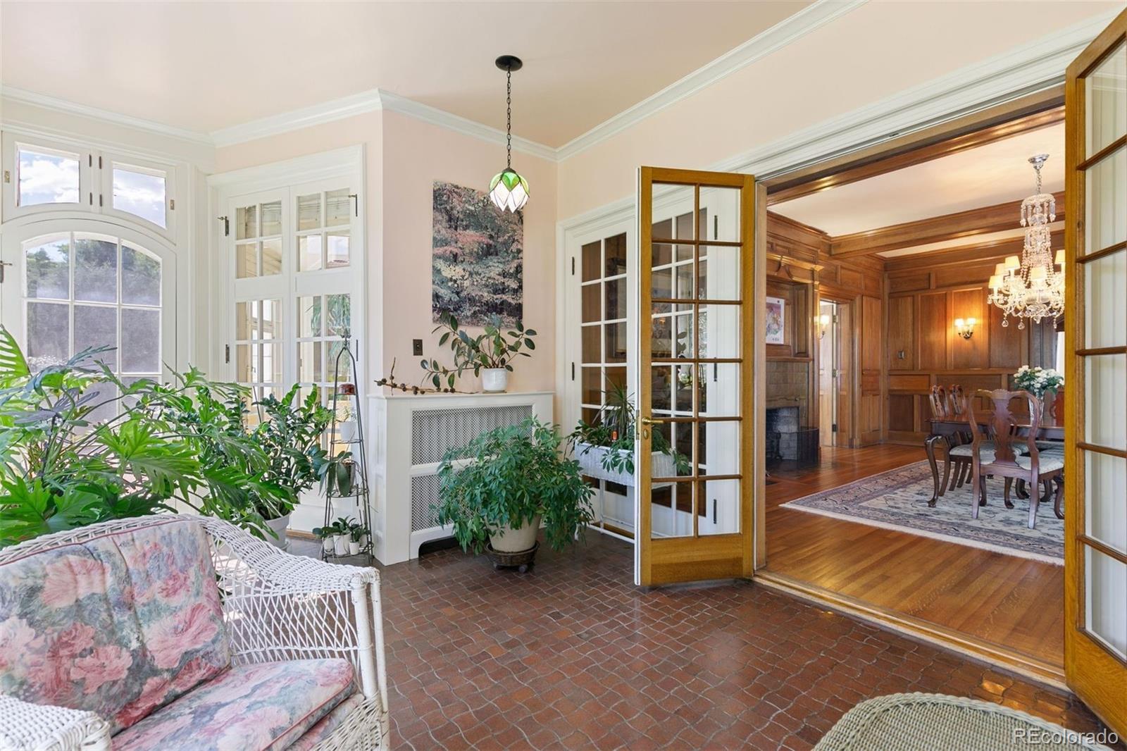 1415 North Cascade Avenue Colorado Springs, CO 80907 - Photo 19 of 48 a living room with furniture and a chandelier