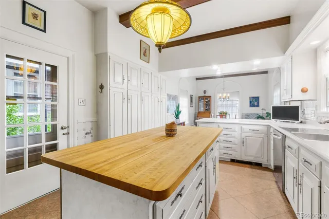 a spacious bedroom with windows and closet