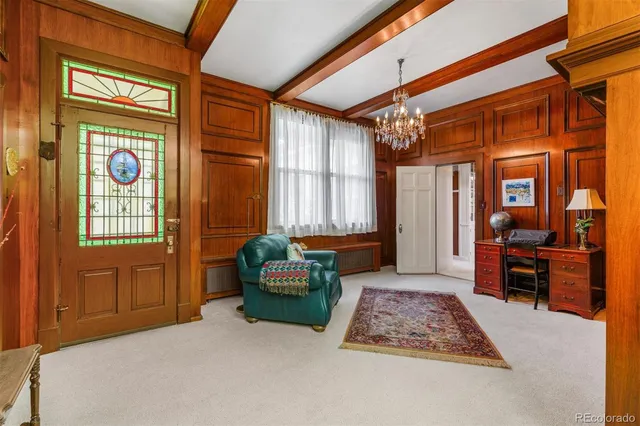 a bedroom with a bed couch and window