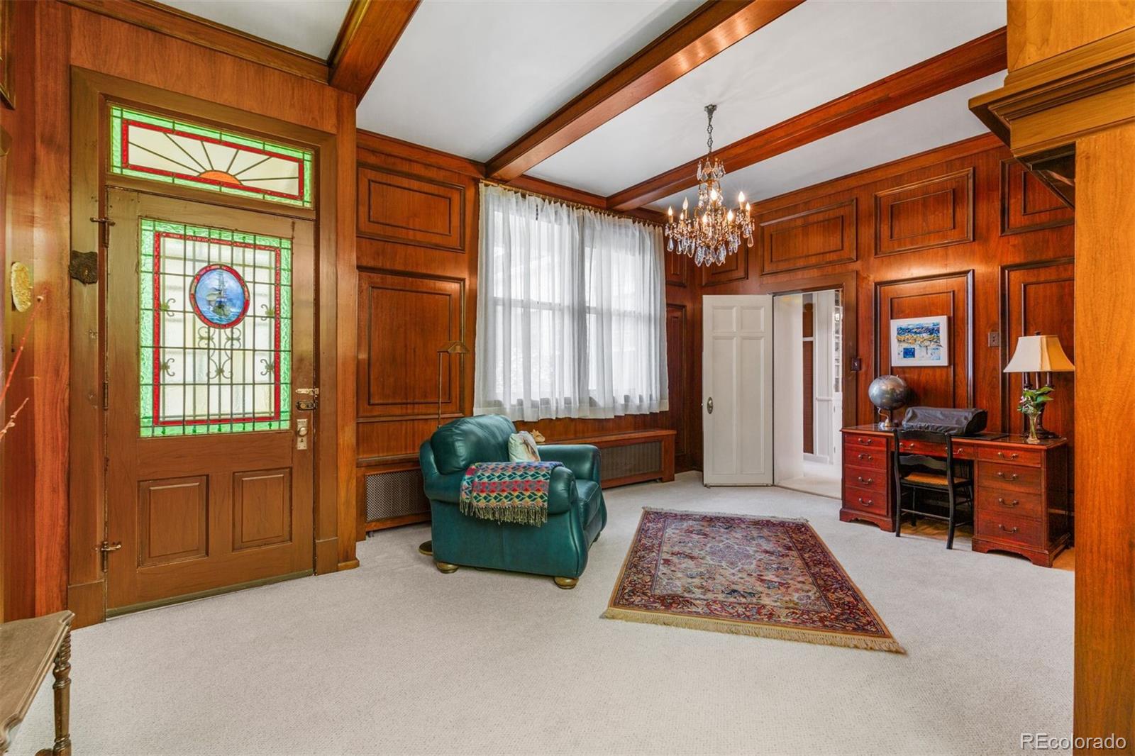 1415 North Cascade Avenue Colorado Springs, CO 80907 - Photo 22 of 48 a living room with furniture and a window