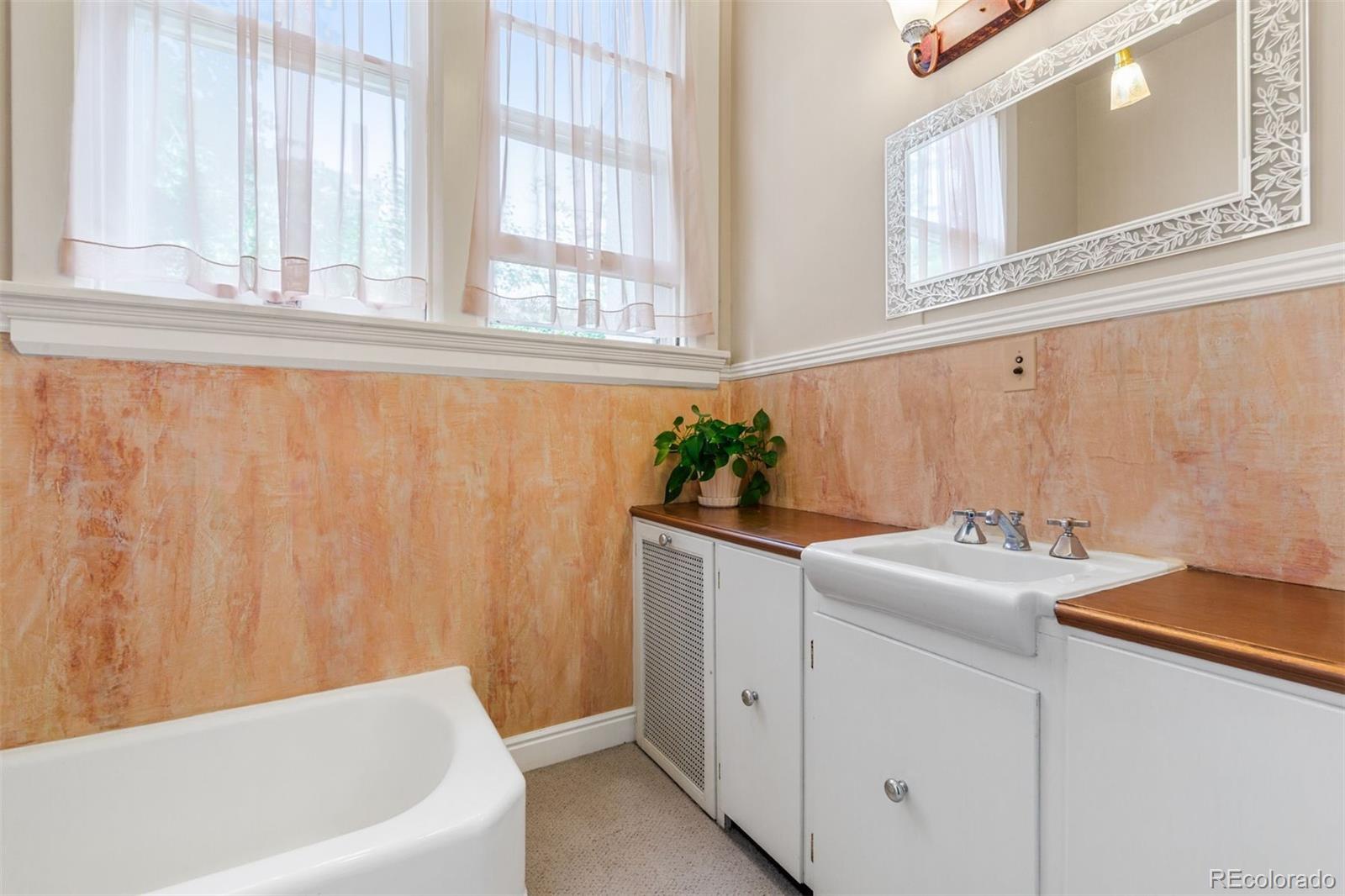 1415 North Cascade Avenue Colorado Springs, CO 80907 - Photo 23 of 48 a bathroom with a sink and a bathtub