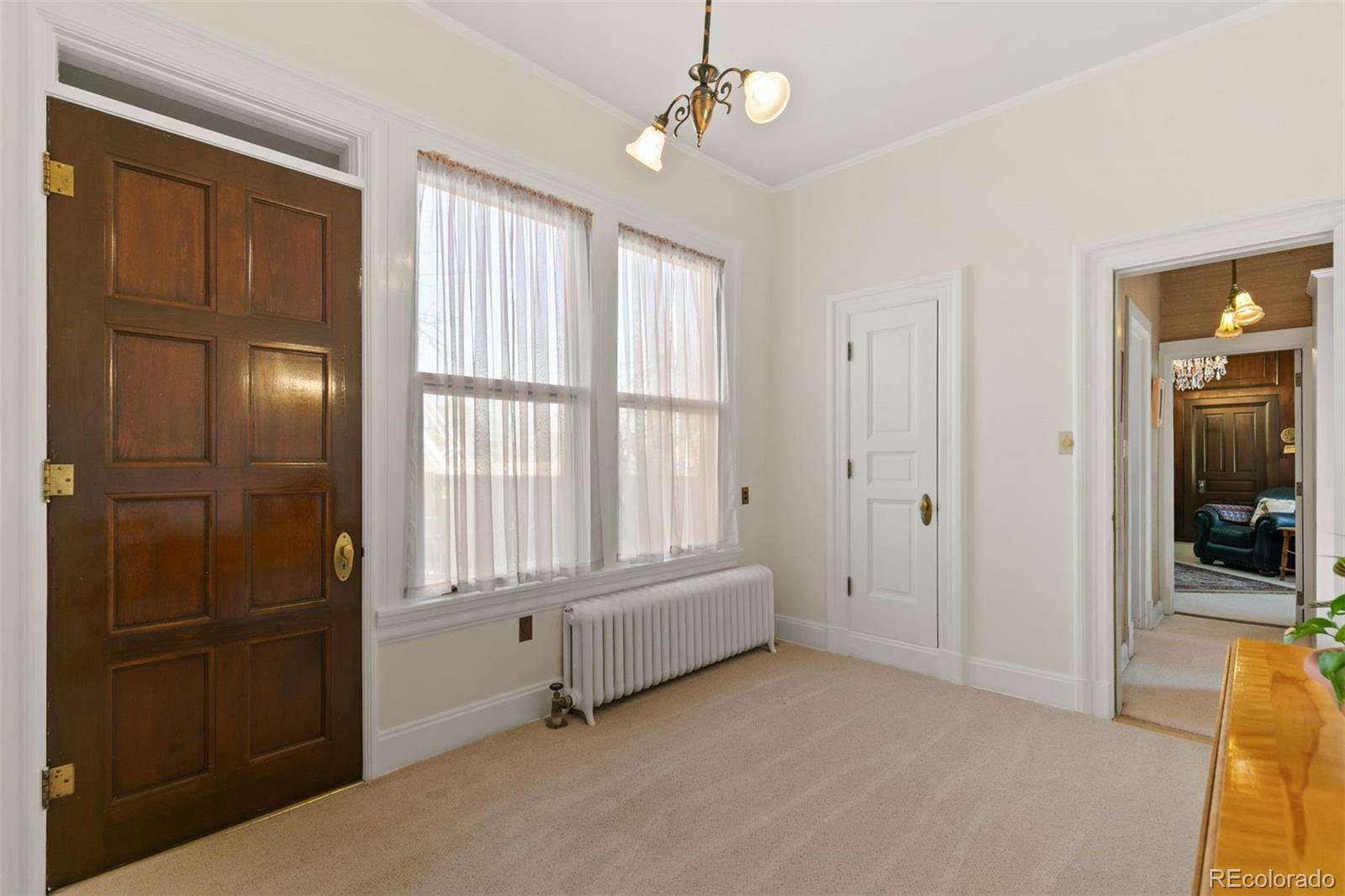 1415 North Cascade Avenue Colorado Springs, CO 80907 - Photo 25 of 48 a spacious bedroom with windows and closet