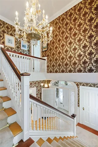 a view of hallway with chandelier
