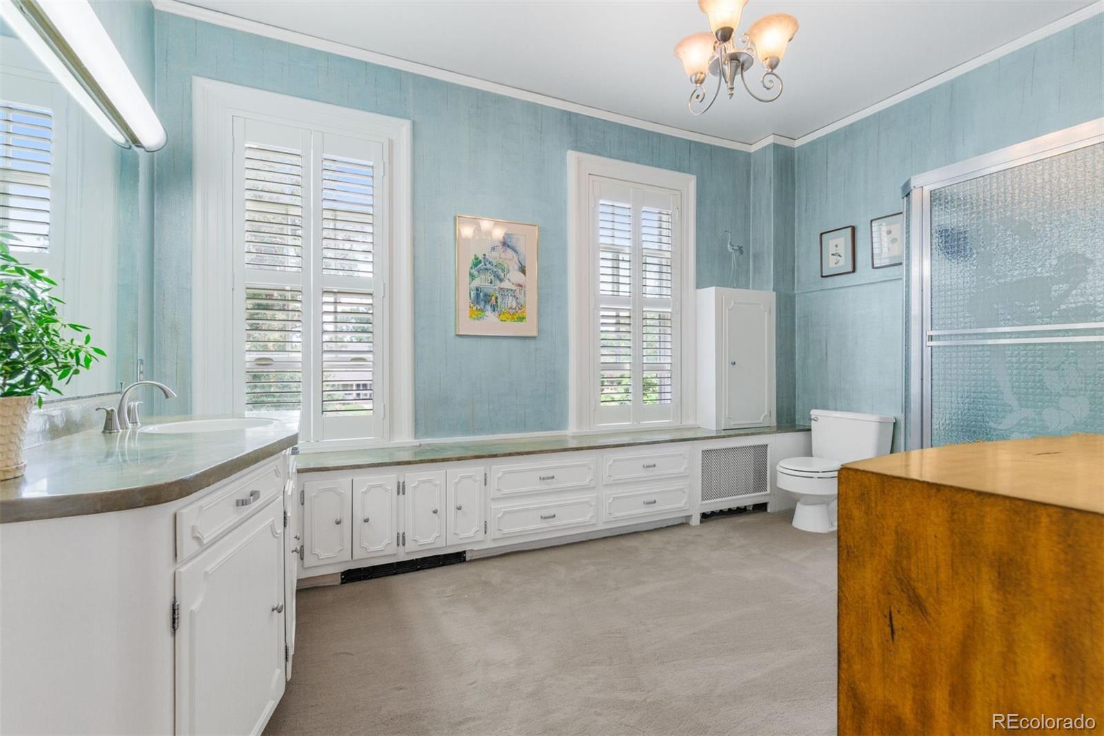 1415 North Cascade Avenue Colorado Springs, CO 80907 - Photo 30 of 48 a spacious bedroom with a large bed and a window