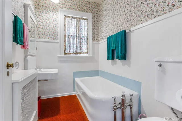 a view of a house with pool and a garden