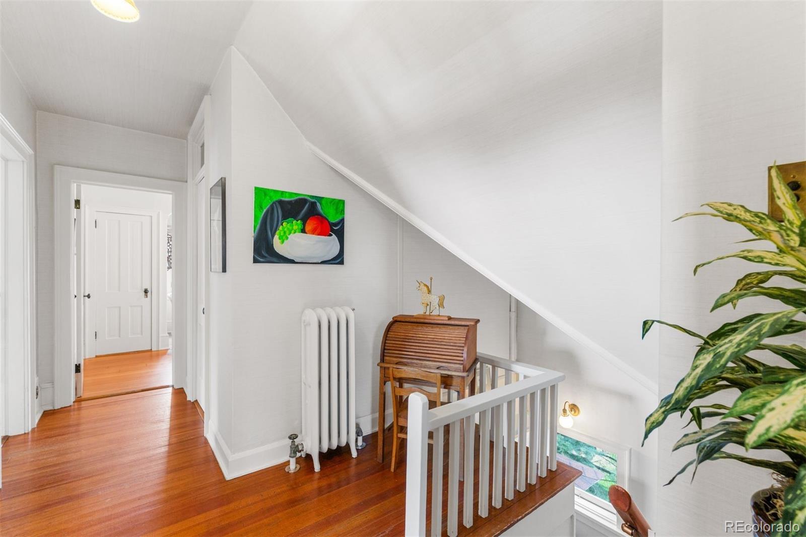 1415 North Cascade Avenue Colorado Springs, CO 80907 - Photo 35 of 48 a living room with furniture and wooden floor