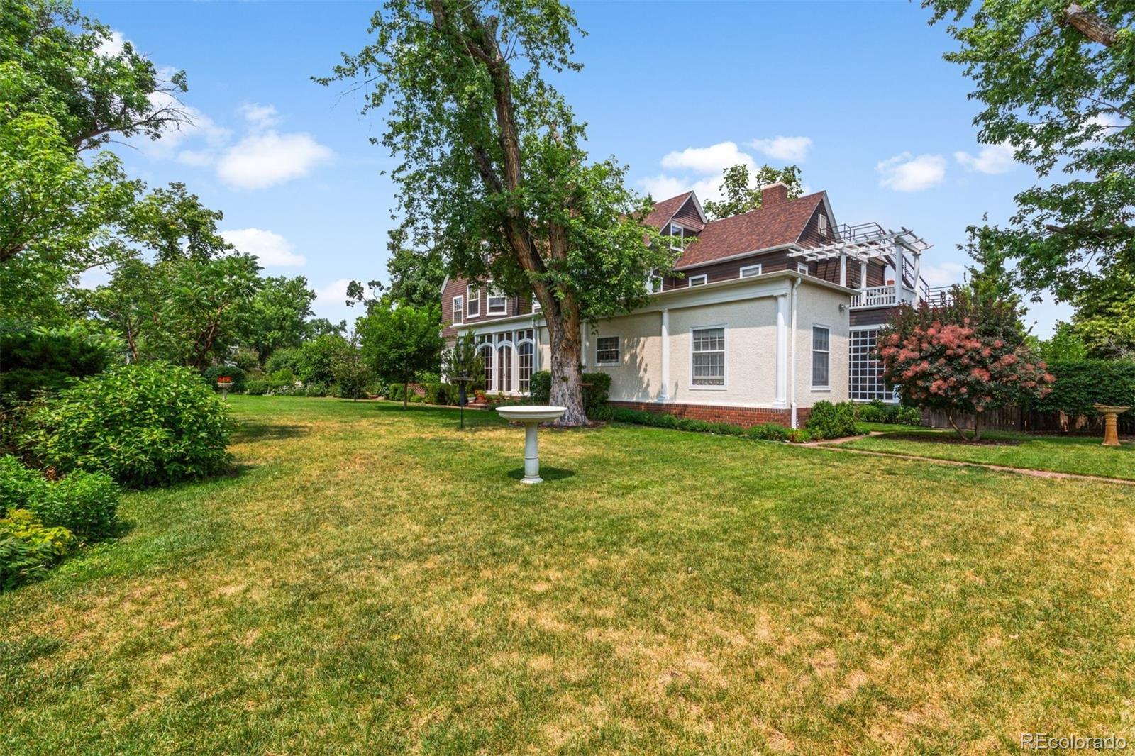 1415 North Cascade Avenue Colorado Springs, CO 80907 - Photo 46 of 48 a view of a house with pool and a garden
