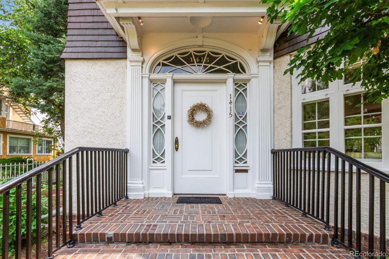 1415 North Cascade Avenue Colorado Springs, CO 80907 - Photo 10 of 48 a view of a wooden door and a yard