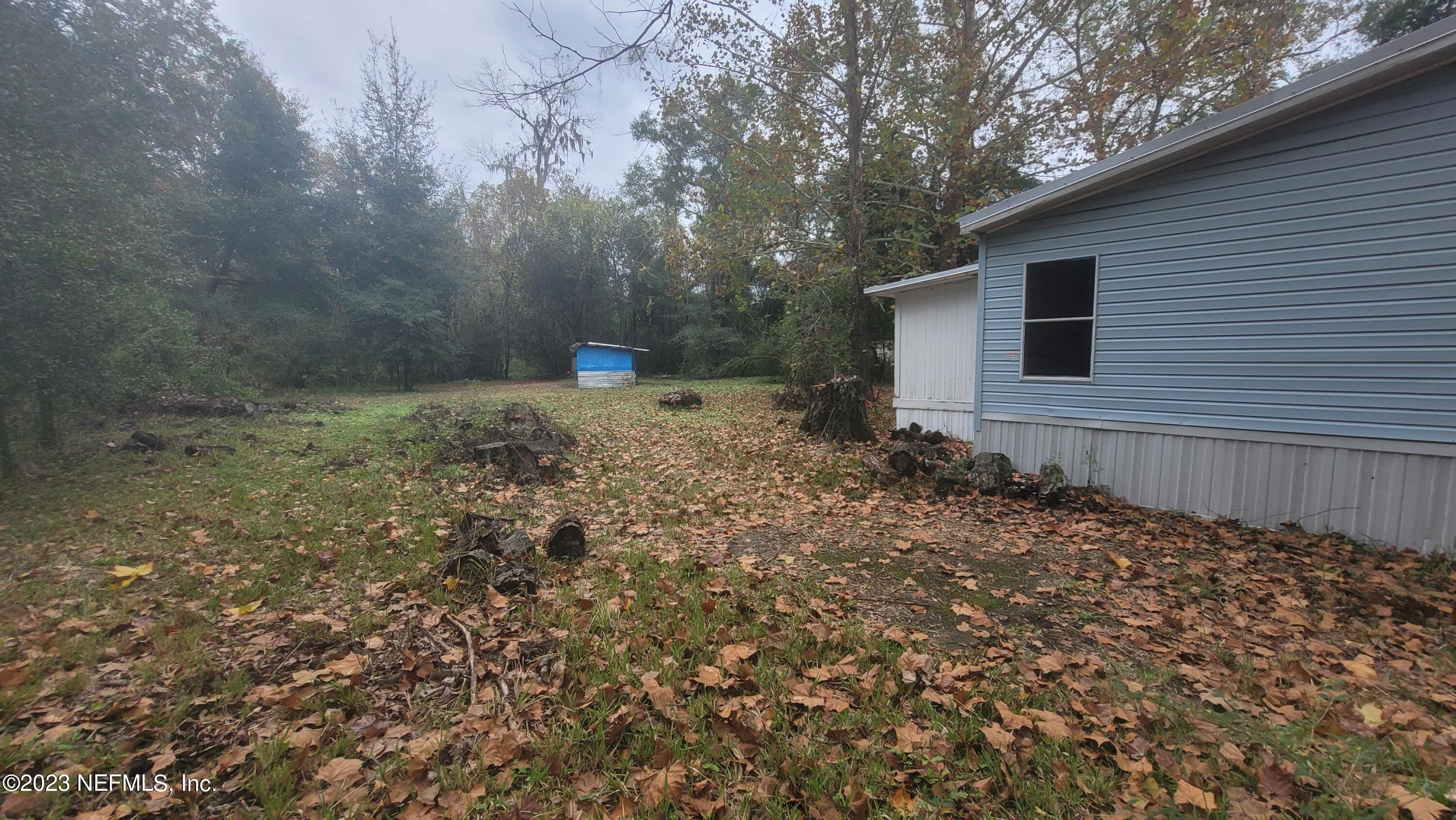 21419 Northwest County 1493 Road Alachua, FL 32615 - Photo 23 of 33 Side View of Home Looking to Back Yard